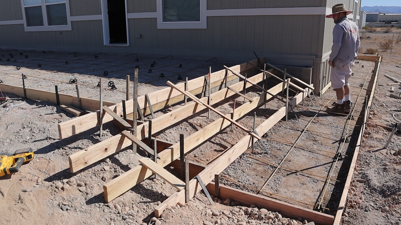 Professional concrete foundation preparation with formwork and rebar
