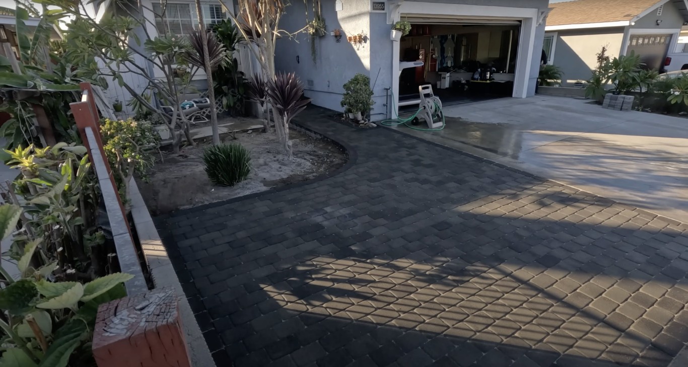Stamped and decorative concrete driveway with brick pattern design